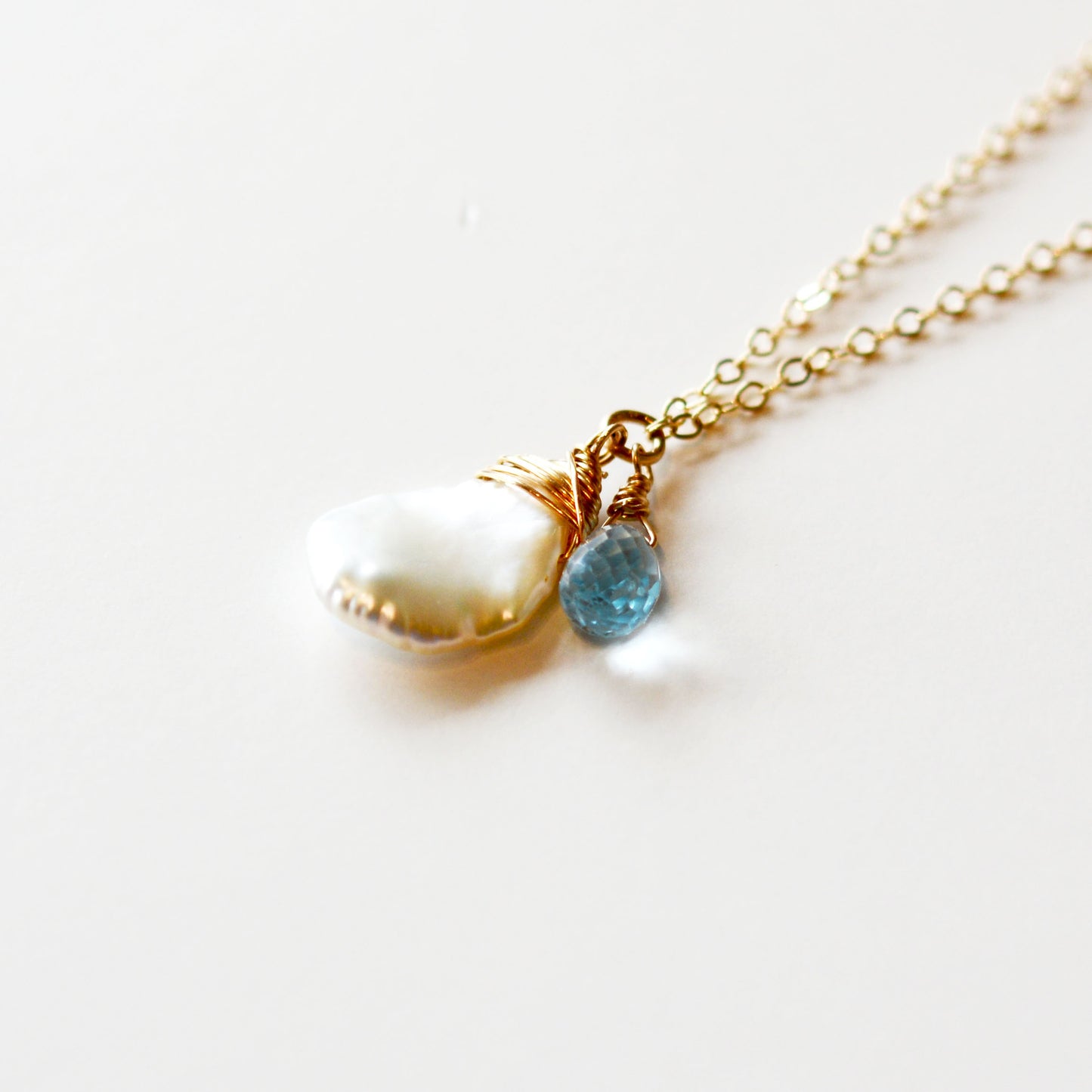 Keshi Pearl Necklace with a Pink Sapphire and Sky Blue Topaz